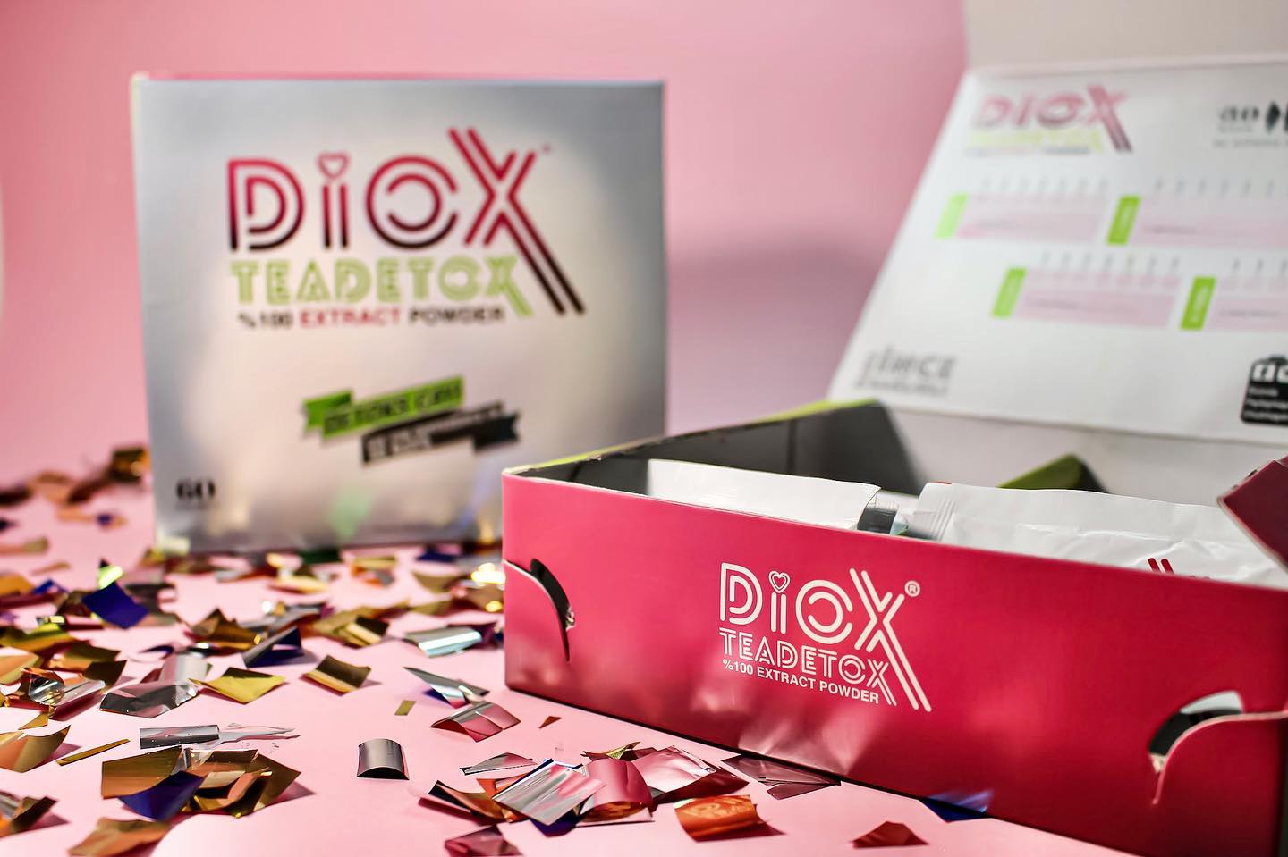 Diox Detox Tea box with tea sachets on pink background